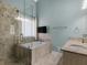 Bathroom showcasing tiled shower and tub combo, granite counters, and a relaxing atmosphere at 135 Oakpark Ter, Mcdonough, GA 30253