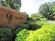 Brick entrance to Oak Park community with landscaped surroundings at 135 Oakpark Ter, Mcdonough, GA 30253