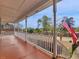 Spacious covered porch with white railing, perfect for relaxing and enjoying the neighborhood views at 135 Oakpark Ter, Mcdonough, GA 30253