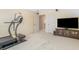 Carpeted exercise area with treadmill and tv at 135 Oakpark Ter, Mcdonough, GA 30253