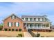 Charming two-story brick home with green shutters and a welcoming front porch at 135 Oakpark Ter, Mcdonough, GA 30253
