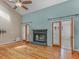 Spacious living room features hardwood floors, fireplace, and vaulted ceiling at 135 Oakpark Ter, Mcdonough, GA 30253