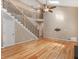 Spacious living room with high ceilings, staircase, and hardwood floors at 135 Oakpark Ter, Mcdonough, GA 30253