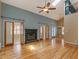 Bright living room boasts vaulted ceiling, fireplace, skylight, and hardwood floors at 135 Oakpark Ter, Mcdonough, GA 30253