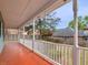 Covered porch with white railing, offering ample space for outdoor relaxation at 135 Oakpark Ter, Mcdonough, GA 30253