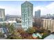 Stunning aerial view showcasing the building's height, surrounding landscape, pool, and ample parking at 2870 Pharr Nw Ct # 2008, Atlanta, GA 30305