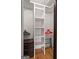 Neat walk-in closet featuring built-in shelves and ample storage space at 2870 Pharr Nw Ct # 2008, Atlanta, GA 30305