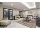 Comfortable living room with modern furnishings, marble floors, and access to an office space via double doors at 2870 Pharr Nw Ct # 2008, Atlanta, GA 30305