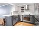 This kitchen has light countertops, blue-gray cabinets and stainless appliances including a modern range hood at 2870 Pharr Nw Ct # 2008, Atlanta, GA 30305