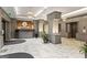 Elegant lobby with modern lighting, marble floors, and a reception desk with 'The Concord' signage at 2870 Pharr Nw Ct # 2008, Atlanta, GA 30305
