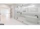 Bathroom with large glass shower, soaking tub, and white tile at 2015 Fontainbleau Dr, Conyers, GA 30094
