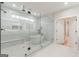 Bathroom with large glass shower, soaking tub, and white tile at 2015 Fontainbleau Dr, Conyers, GA 30094