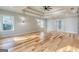 Spacious bedroom with tray ceilings, recessed lighting, hardwood floors and natural light at 2015 Fontainbleau Dr, Conyers, GA 30094