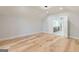Bright bedroom with hardwood, leading to the bathroom's modern vanity and walk-in shower at 2015 Fontainbleau Dr, Conyers, GA 30094