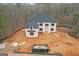 View of new construction home with black roof and unfinished landscaping at 2015 Fontainbleau Dr, Conyers, GA 30094