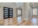 Spacious foyer with hardwood floors, featuring high ceilings and modern front doors at 2015 Fontainbleau Dr, Conyers, GA 30094