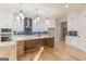 Gourmet kitchen featuring custom cabinets, marble countertops, large island, and stainless steel appliances at 2015 Fontainbleau Dr, Conyers, GA 30094