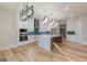 Spacious kitchen with large island, stainless steel appliances, custom cabinets, and modern lighting fixtures at 2015 Fontainbleau Dr, Conyers, GA 30094