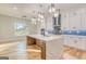 Bright modern kitchen with stainless appliances, marble countertops, blue backsplash, and hardwood floors at 2015 Fontainbleau Dr, Conyers, GA 30094