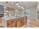 Modern kitchen featuring a large island with marble countertops, stainless steel appliances, and stylish pendant lighting at 2015 Fontainbleau Dr, Conyers, GA 30094