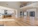 Expansive living area with open view to kitchen, wood floors and second floor balcony at 2015 Fontainbleau Dr, Conyers, GA 30094