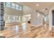 Bright living room featuring high ceilings, fireplace, many large windows, and hardwood flooring at 2015 Fontainbleau Dr, Conyers, GA 30094