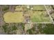 Overhead shot featuring a large field, pond and wooded area at 757 Fischer Rd, Sharpsburg, GA 30277