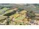 Expansive aerial view showcasing the property's vast land, mature trees, and neighborhood at 757 Fischer Rd, Sharpsburg, GA 30277