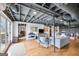 Finished basement with exposed ceiling, hardwood flooring, and space for a playroom at 757 Fischer Rd, Sharpsburg, GA 30277