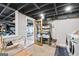 Unfinished basement features laundry area and storage shelving at 757 Fischer Rd, Sharpsburg, GA 30277