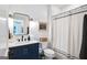 Stylish bathroom with a modern vanity, subway tile, and patterned shower curtain at 757 Fischer Rd, Sharpsburg, GA 30277