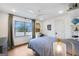 Bright bedroom with a ceiling fan, large window and view to the backyard at 757 Fischer Rd, Sharpsburg, GA 30277