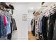 Walk-in closet with shelving and rods for clothing and shoe storage at 757 Fischer Rd, Sharpsburg, GA 30277