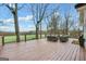 Spacious wooden deck with outdoor seating that overlooks a lush backyard and expansive wooded views at 757 Fischer Rd, Sharpsburg, GA 30277