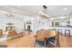 Open concept floorplan of dining room with fireplace, living room, and kitchen at 757 Fischer Rd, Sharpsburg, GA 30277