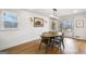 Dining area with wood table and seating, natural light, and hardwood floors at 757 Fischer Rd, Sharpsburg, GA 30277