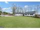 Expansive home with a basketball court beside the meticulously kept lawn at 757 Fischer Rd, Sharpsburg, GA 30277