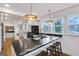 Modern kitchen features black marble countertops and stainless steel appliances at 757 Fischer Rd, Sharpsburg, GA 30277