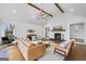 Stylish living room with stone fireplace, hardwood floors, and comfortable seating at 757 Fischer Rd, Sharpsburg, GA 30277