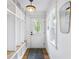 Mudroom features built-in storage, a bench, and a rear entry door at 757 Fischer Rd, Sharpsburg, GA 30277