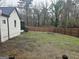 Spacious backyard featuring a privacy fence and mature trees at 3930 W Side Pl, Ellenwood, GA 30294