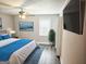 Comfortable bedroom with a ceiling fan, modern décor, and a wall-mounted television at 3930 W Side Pl, Ellenwood, GA 30294