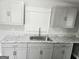 Bright kitchen featuring gray cabinets, stainless steel sink, and lovely granite countertops at 3930 W Side Pl, Ellenwood, GA 30294