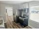 Well-lit kitchen boasts stainless steel appliances including a refrigerator, oven and microwave at 3930 W Side Pl, Ellenwood, GA 30294