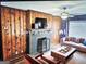 Digitally staged living room with brick fireplace at 3930 W Side Pl, Ellenwood, GA 30294