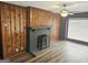 Charming living room with fireplace and wood paneling at 3930 W Side Pl, Ellenwood, GA 30294