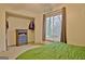 Bright bedroom featuring a large window, closet, and blue dresser against neutral walls at 101 Nightwind Ct, Peachtree City, GA 30269