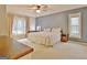 This main bedroom features a king bed, desk, and natural lighting at 101 Nightwind Ct, Peachtree City, GA 30269