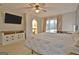 This spacious main bedroom features a king bed, tv and natural lighting at 101 Nightwind Ct, Peachtree City, GA 30269