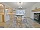 This dining room features stylish lighting and a wood burning fireplace at 101 Nightwind Ct, Peachtree City, GA 30269